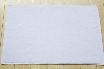 Plain white soft 100% cotton bath mat